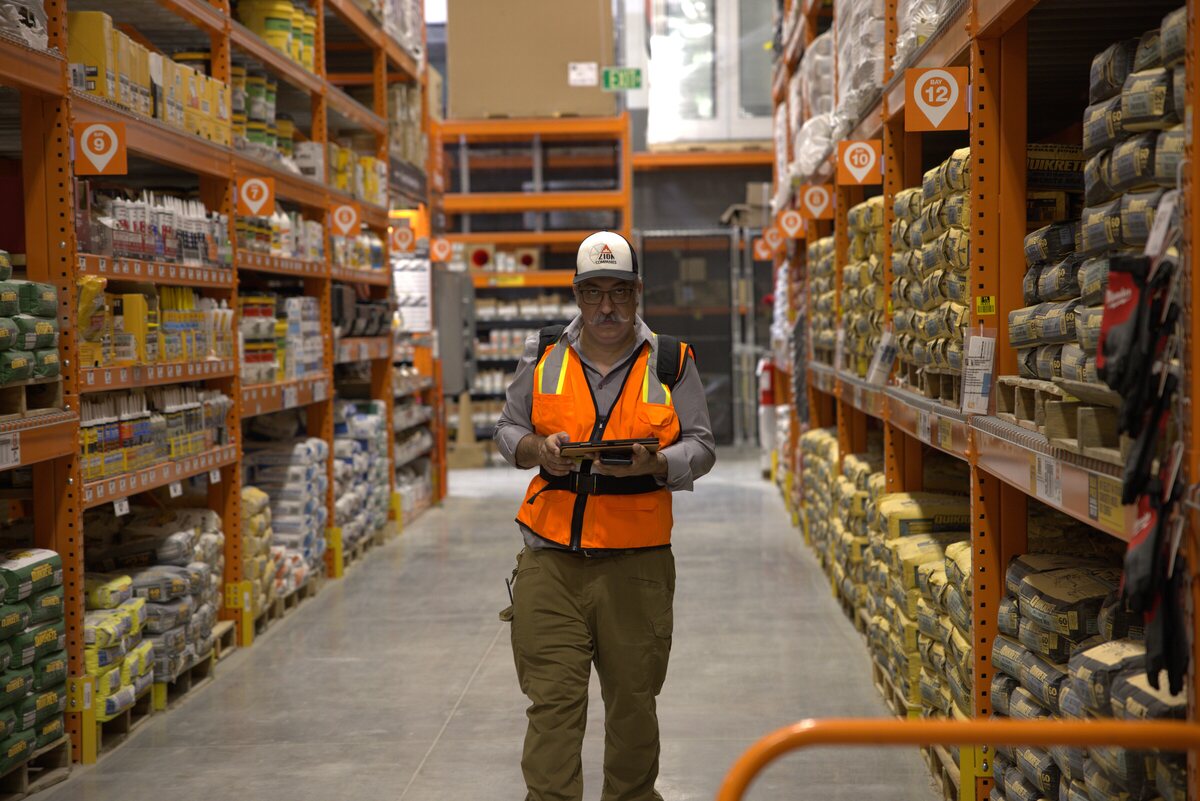 Joel Sadowsky performing an NFPA 1225 grid-square signal survey inside a Texas warehouse — the type of test Building Signal Check helps owners scope before scheduling